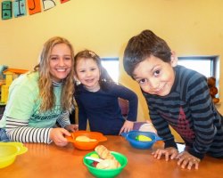 Volunteer with children at the CMC in Madison